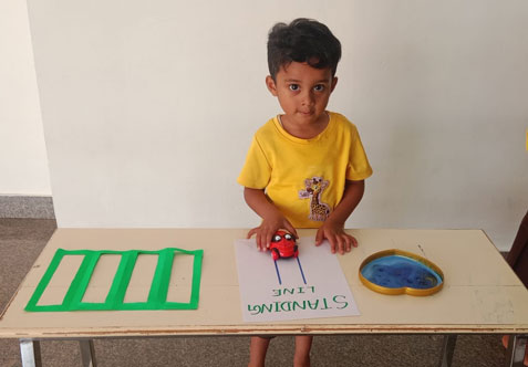 Draw a line on the A4 paper by moving a toy car, creating a fun and interactive way to develop fine motor skills and hand-eye coordination, preparing little hands for writing.